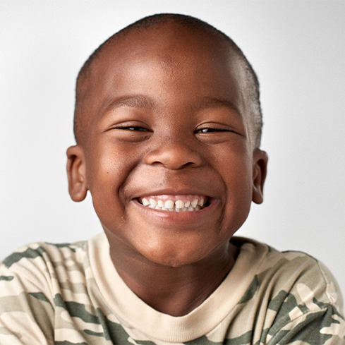 smiling child after getting tongue-tie treatment in South Loop