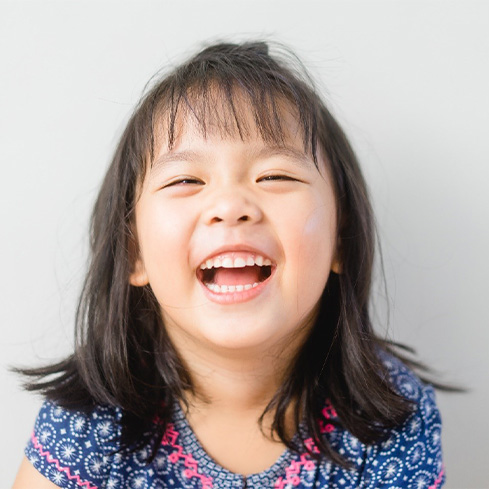 happy, smiling child after undergoing a laser frenectomy in South Loop