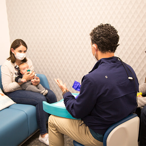 Dentist performing frenectomy