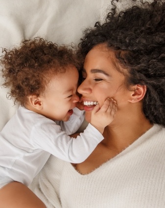 Laughing mother and baby