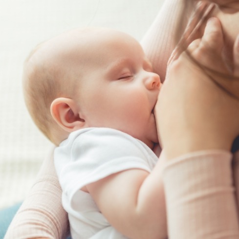 Baby breast feeding during lactation consultation
