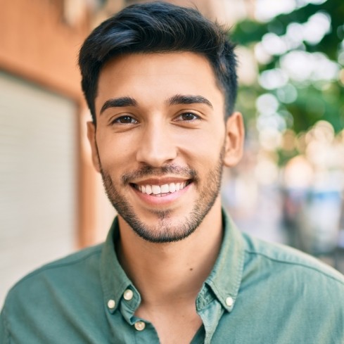 Man smiling after lip and Tongue-Tie treatment